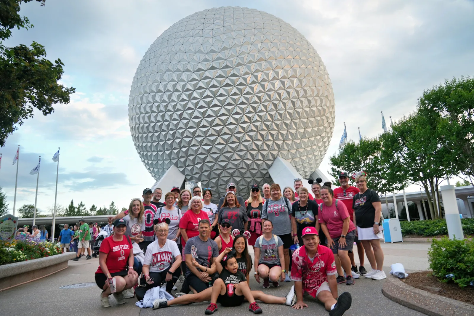Orlando Buckeyes alumni gathered at Epcot in front of Spaceship Earth